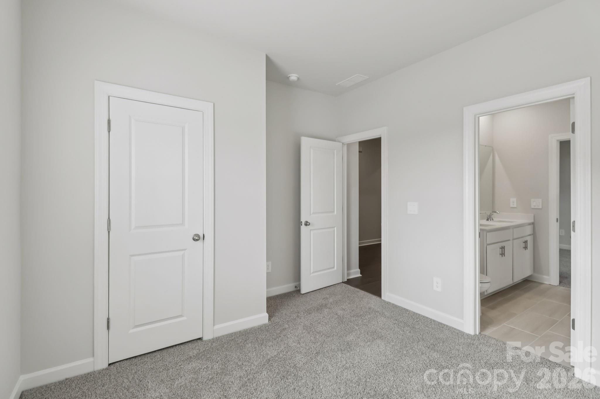 2449 Chartwell Street Stanley, NC 28164 - Photo 10 of 23 a view of a hallway with closet and wooden door