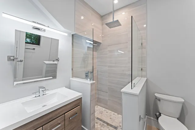 a kitchen with stainless steel appliances a sink stove and refrigerator