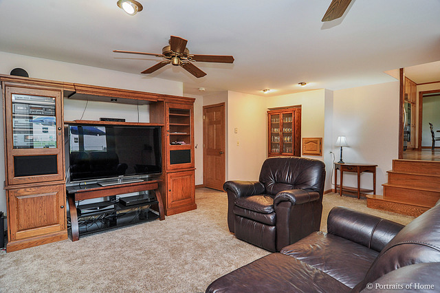 N549 Pleasant Hill Road Wheaton, IL 60187 - Photo 12 of 25 a living room with furniture and a flat screen tv