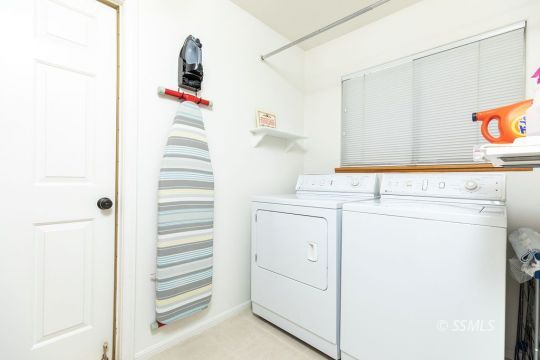 1217 Flora Way Ridgecrest, CA 93555 - Photo 31 of 39 a bathroom with a sink and a shower