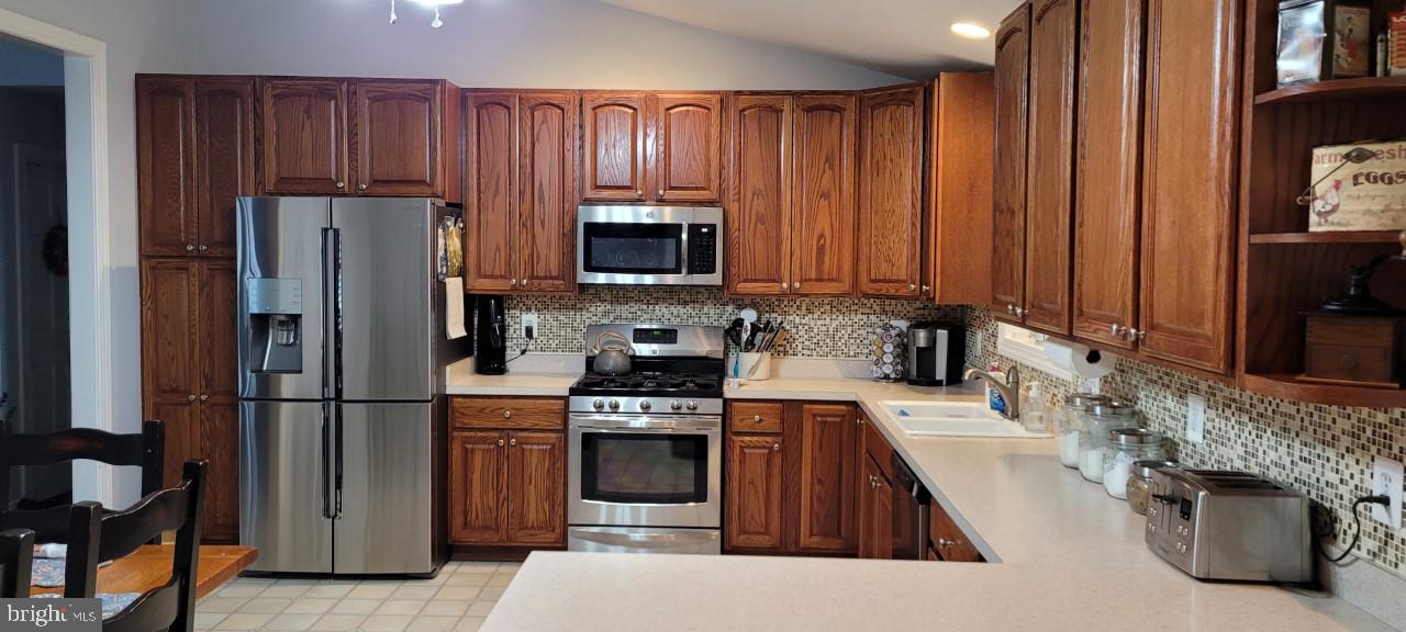 7607 Harmans Road Hanover, MD 21076 - Photo 4 of 36 Kitchen with Stainless Steel Appliances