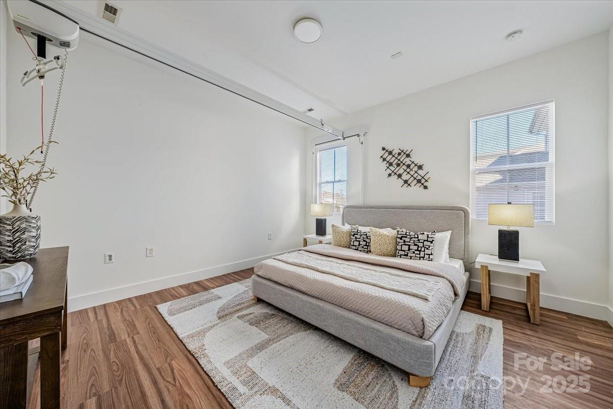 6517 Old Magnolia Lane Mint Hill, NC 28227 - Photo 22 of 46 a bedroom with a bed and a night stand