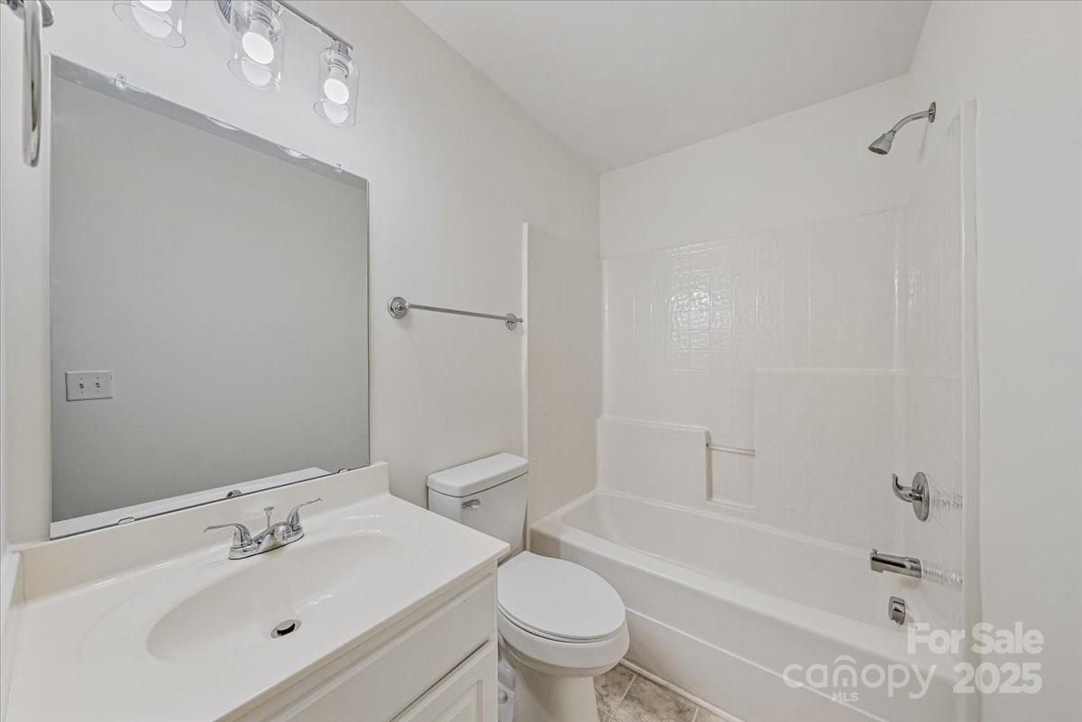 6517 Old Magnolia Lane Mint Hill, NC 28227 - Photo 31 of 46 a bathroom with a bathtub shower sink vanity and toilet