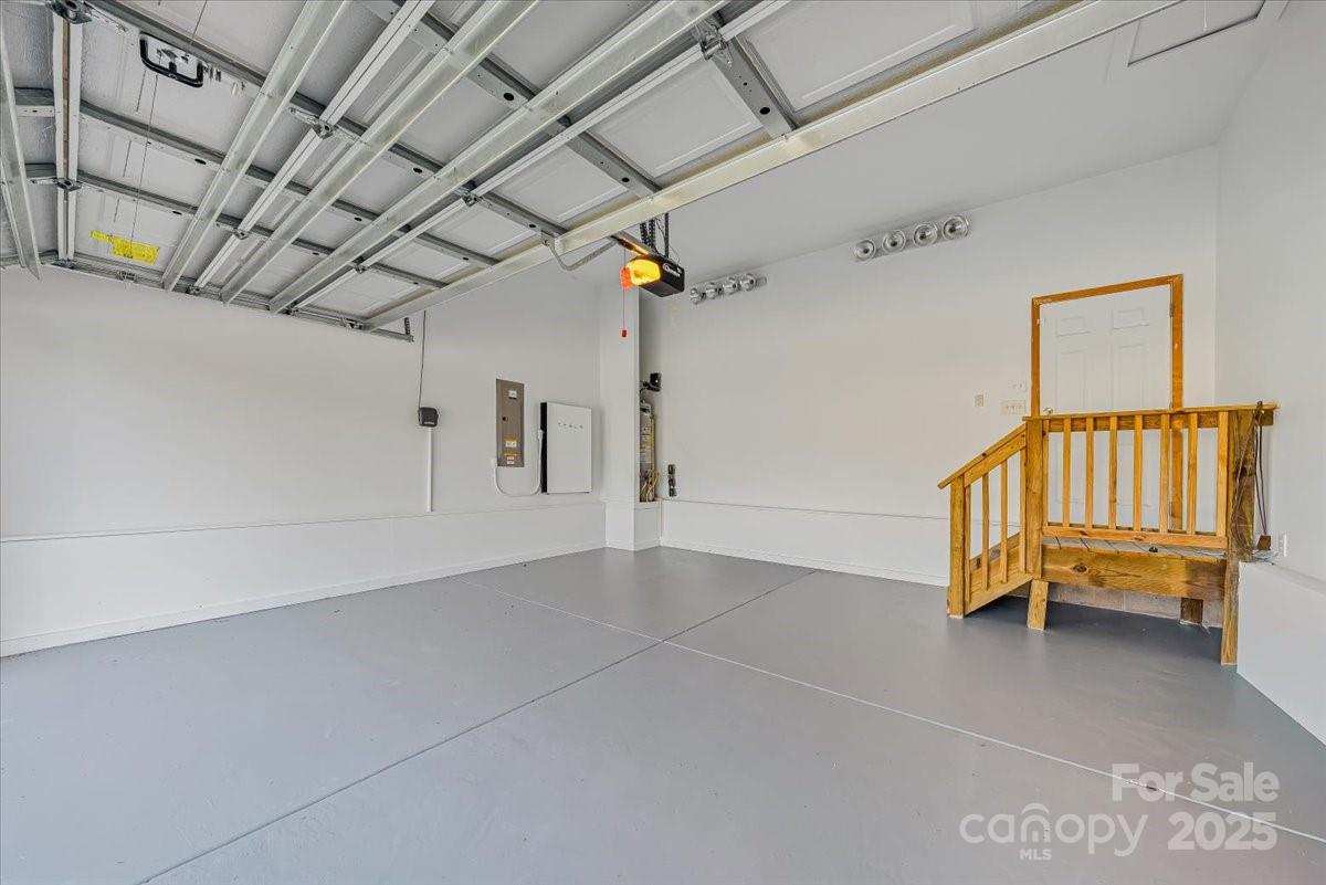 6517 Old Magnolia Lane Mint Hill, NC 28227 - Photo 41 of 46 a view of a livingroom with stairs a chandelier