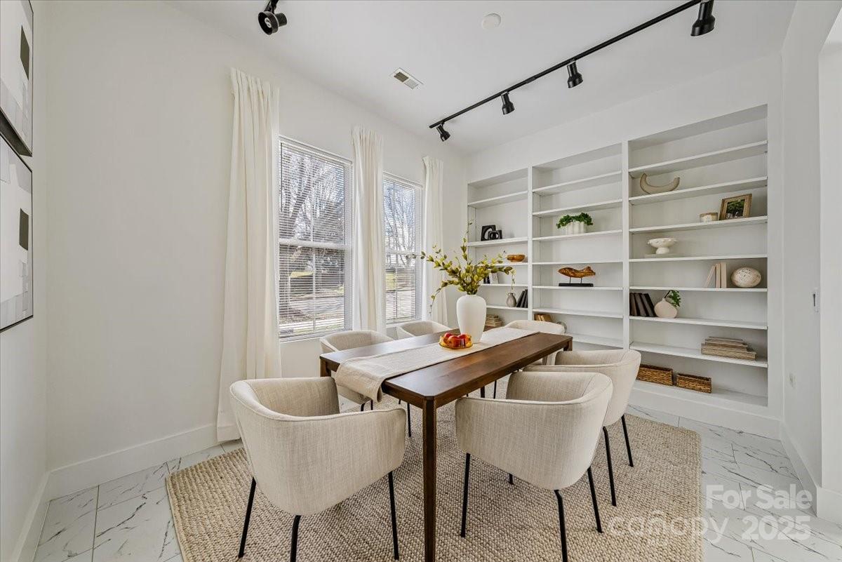 6517 Old Magnolia Lane Mint Hill, NC 28227 - Photo 5 of 46 a view of a dining room with furniture and a window