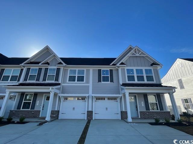 241 Bent Green, Unit 64A Murrells Inlet, SC 29576 - Photo 1 of 16 Craftsman-style house with driveway, brick siding,