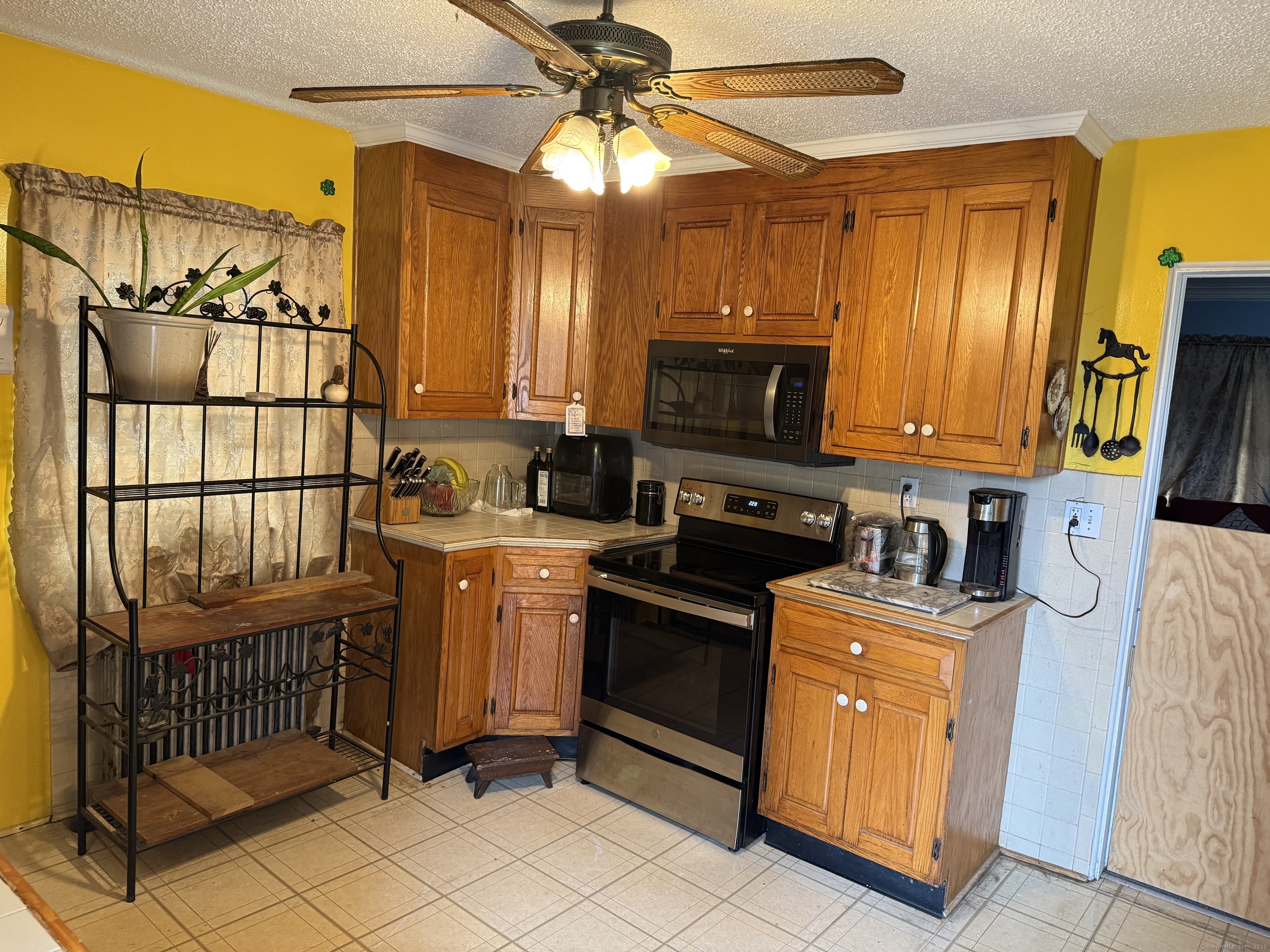181 City View Avenue Bridgeport, CT 06606 - Photo 11 of 33 a kitchen that has a sink and a stove top oven