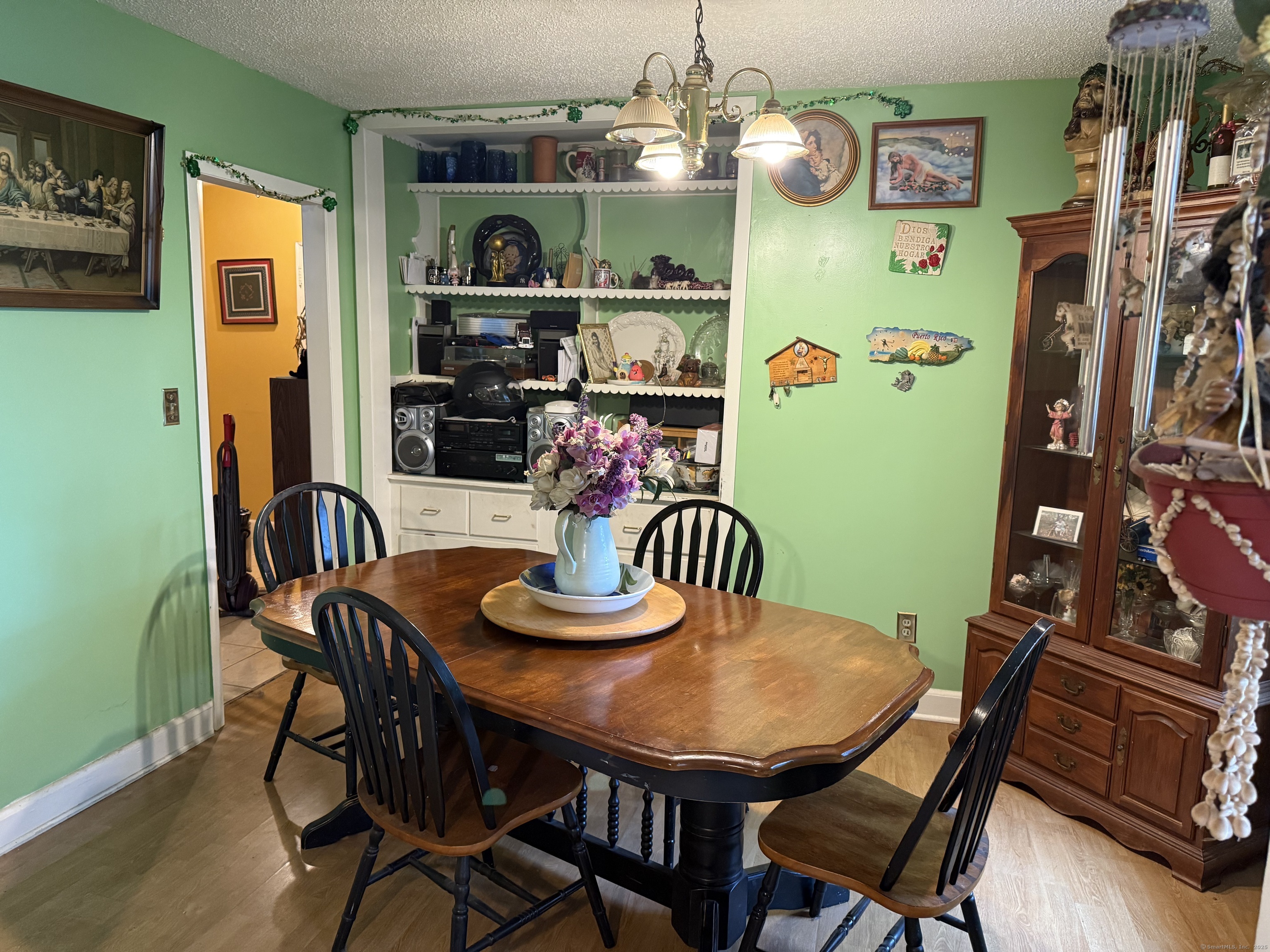 181 City View Avenue Bridgeport, CT 06606 - Photo 14 of 33 a view of a dining room with furniture and wooden floor