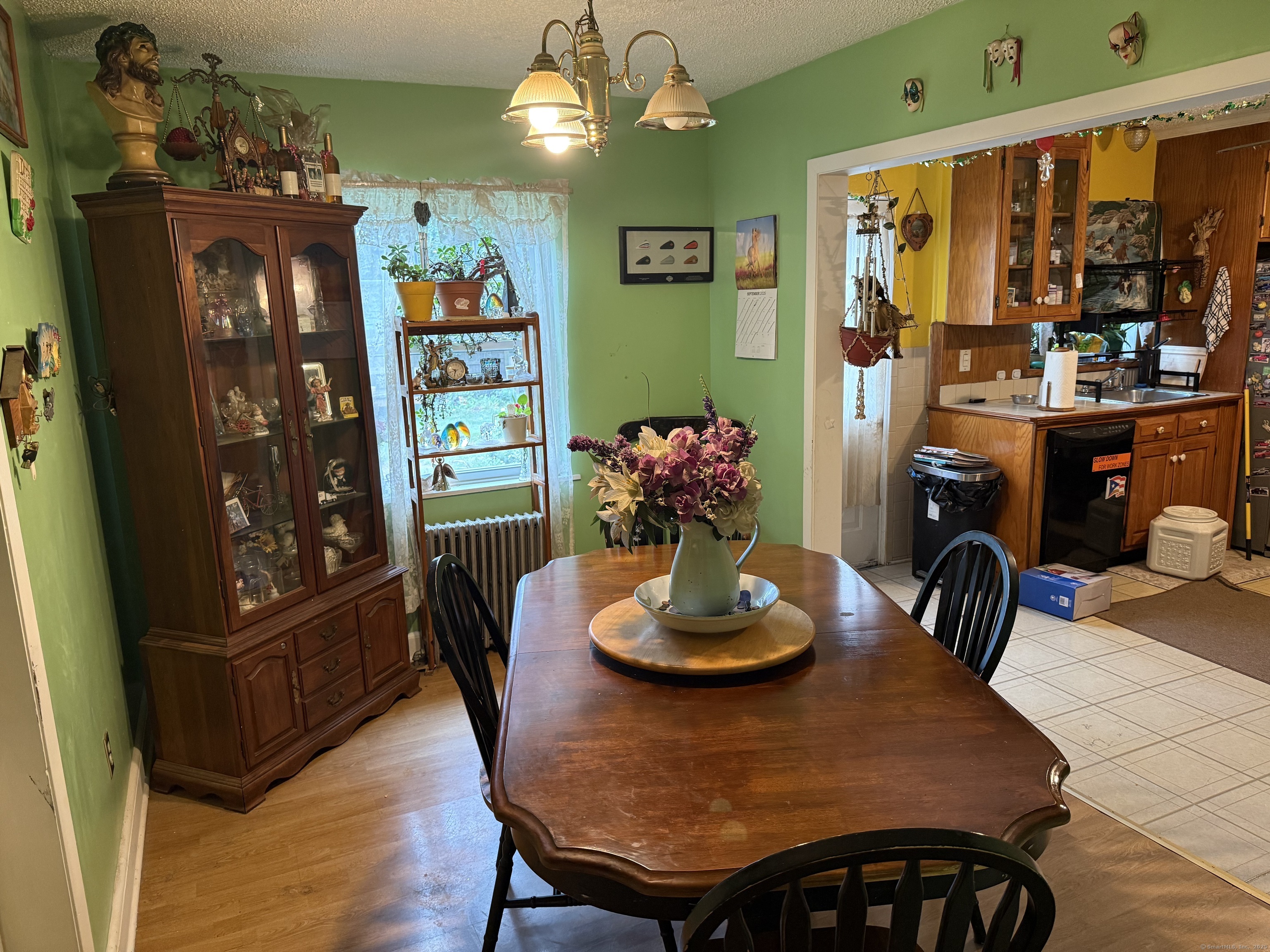 181 City View Avenue Bridgeport, CT 06606 - Photo 15 of 33 a view of a dining room with furniture and chandelier