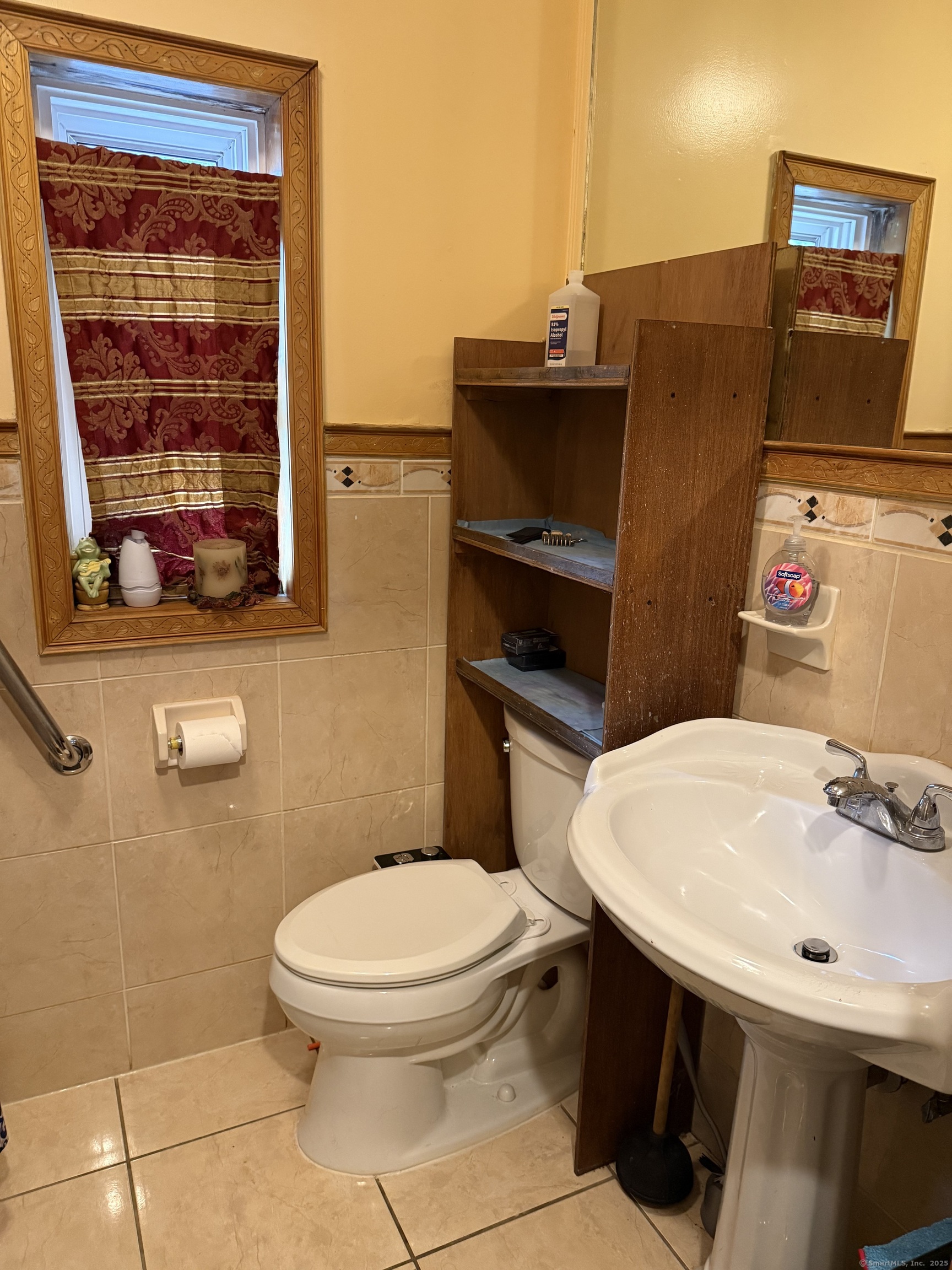 181 City View Avenue Bridgeport, CT 06606 - Photo 18 of 33 a bathroom with a toilet sink and mirror