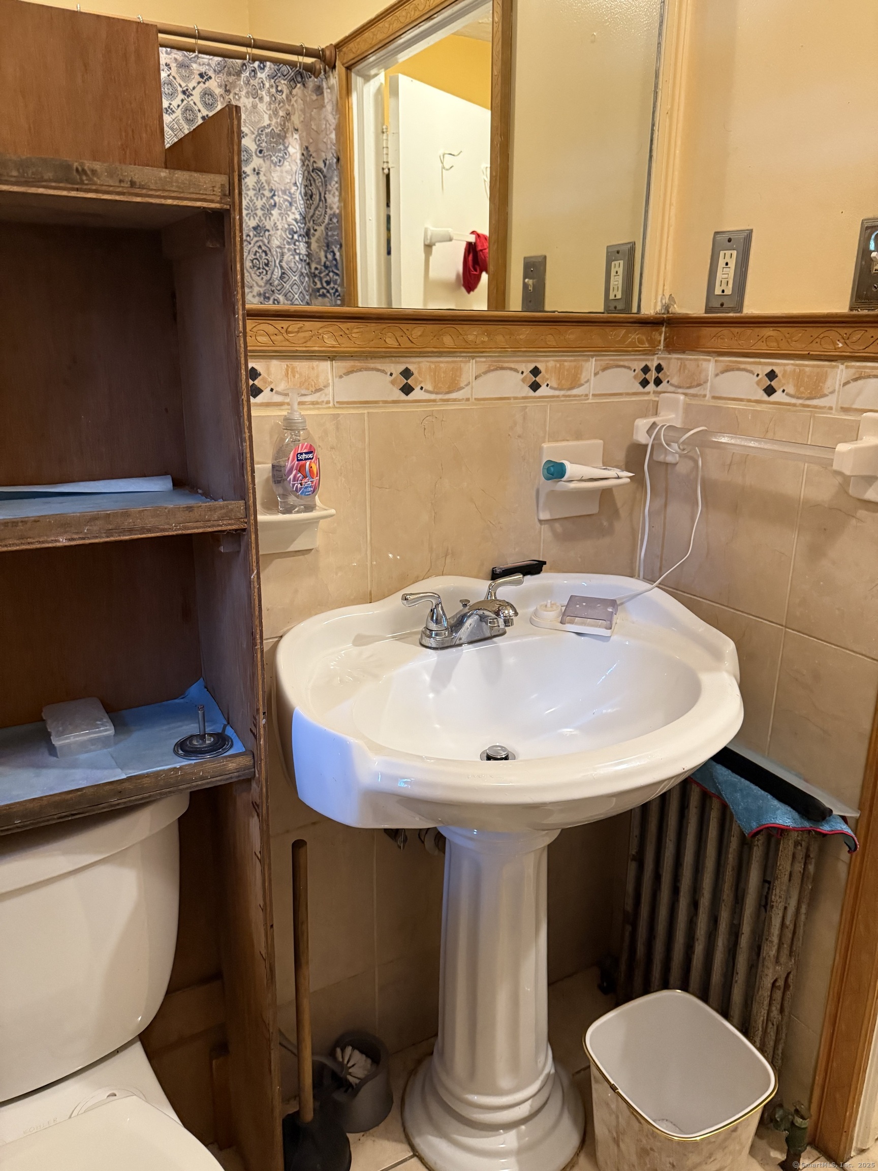 181 City View Avenue Bridgeport, CT 06606 - Photo 20 of 33 a bathroom with a sink a toilet and a mirror