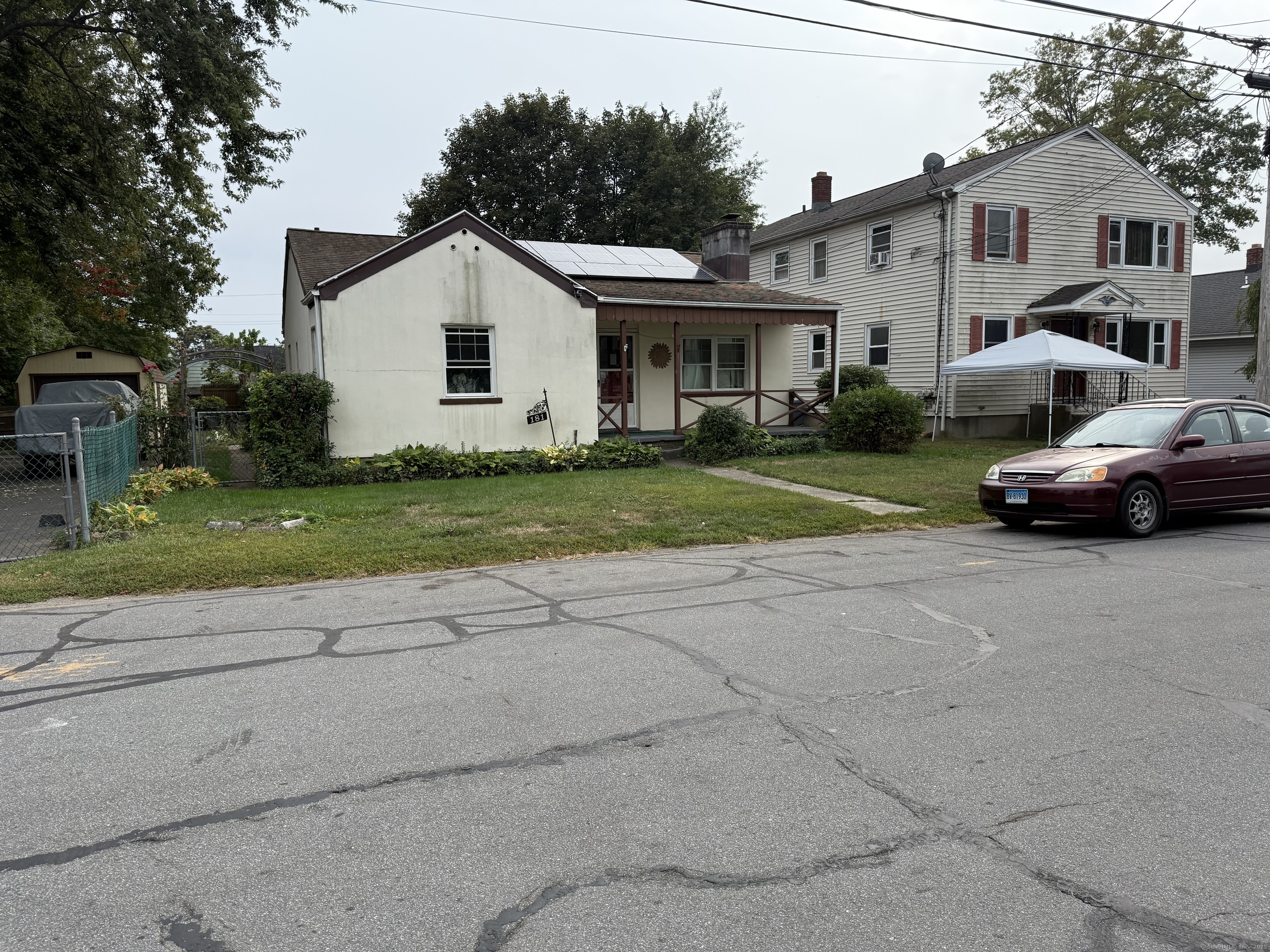 181 City View Avenue Bridgeport, CT 06606 - Photo 2 of 33 a view of a white house next to a yard and road