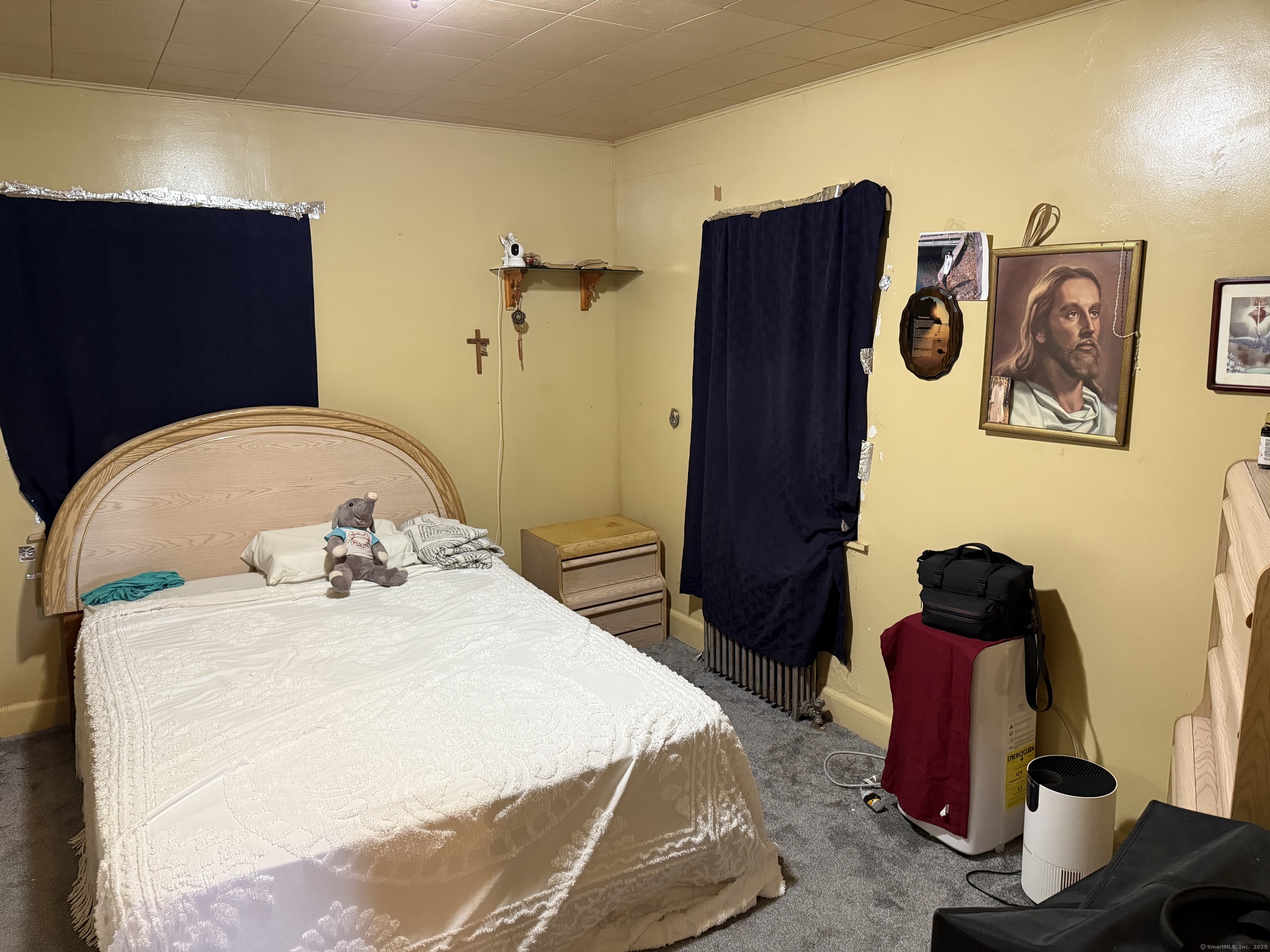 181 City View Avenue Bridgeport, CT 06606 - Photo 23 of 33 a bedroom with a bed and wooden floor