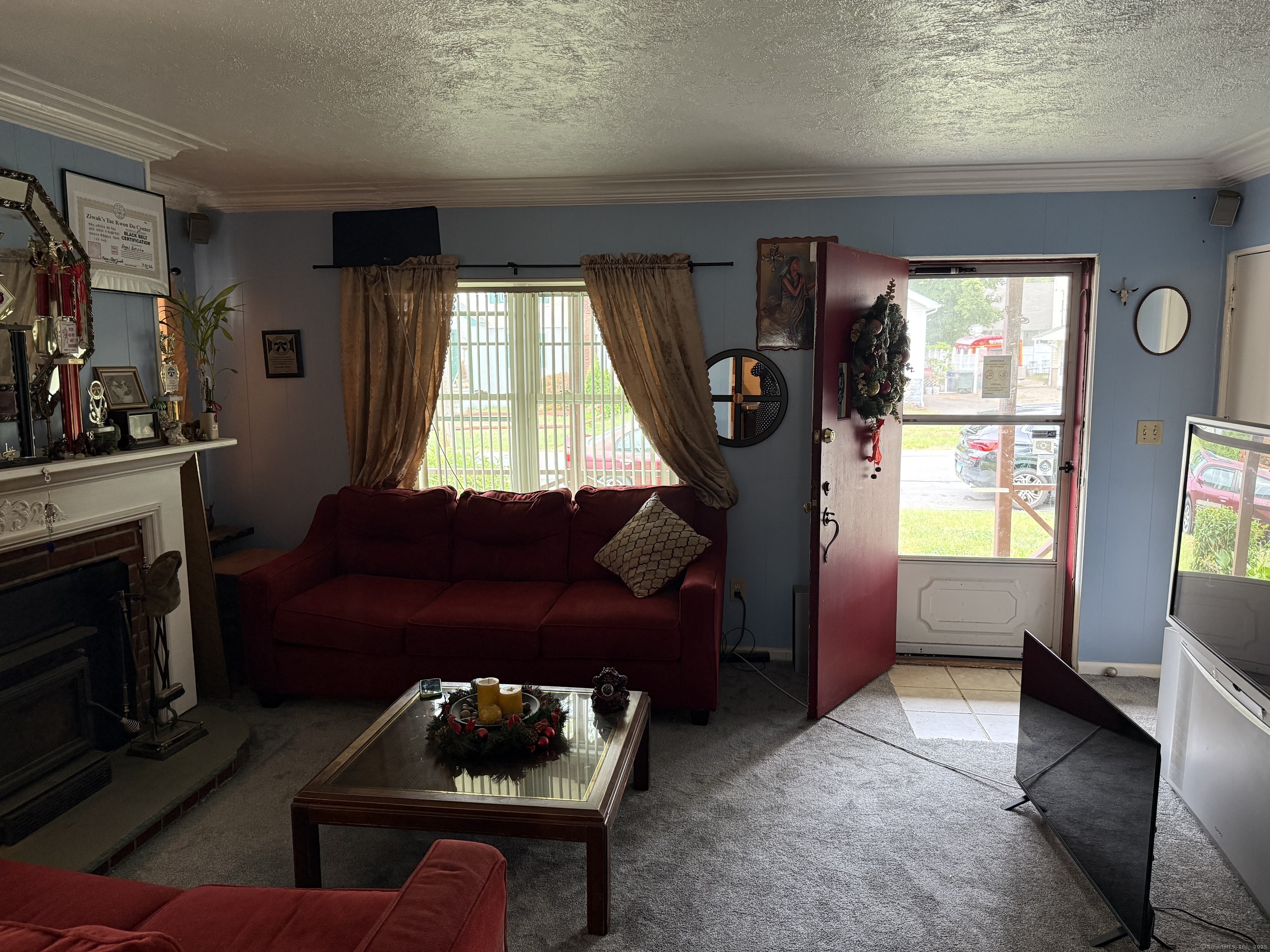 181 City View Avenue Bridgeport, CT 06606 - Photo 27 of 33 a living room with furniture and a fireplace