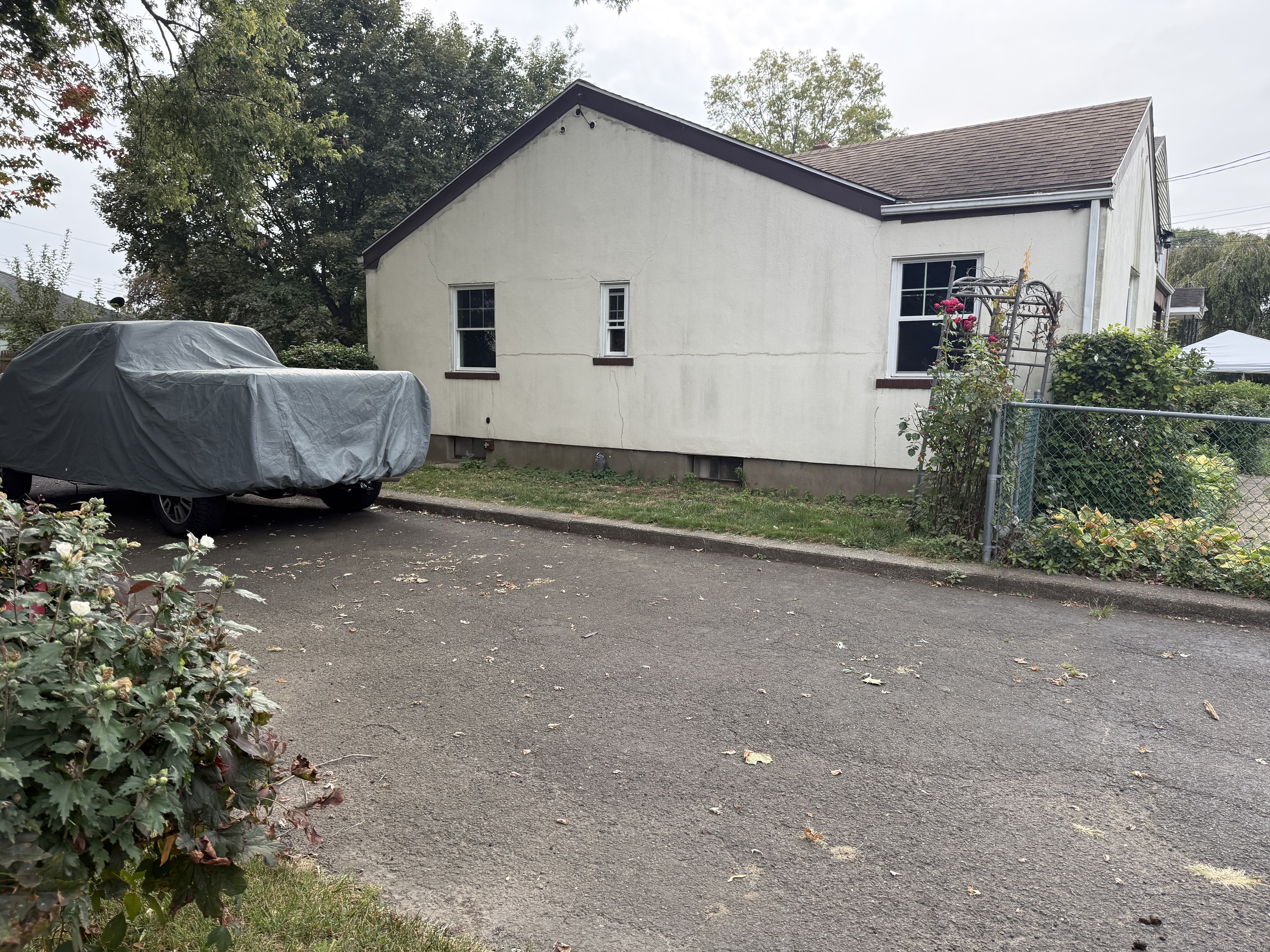 181 City View Avenue Bridgeport, CT 06606 - Photo 4 of 33 a view of a house with a yard and a garage
