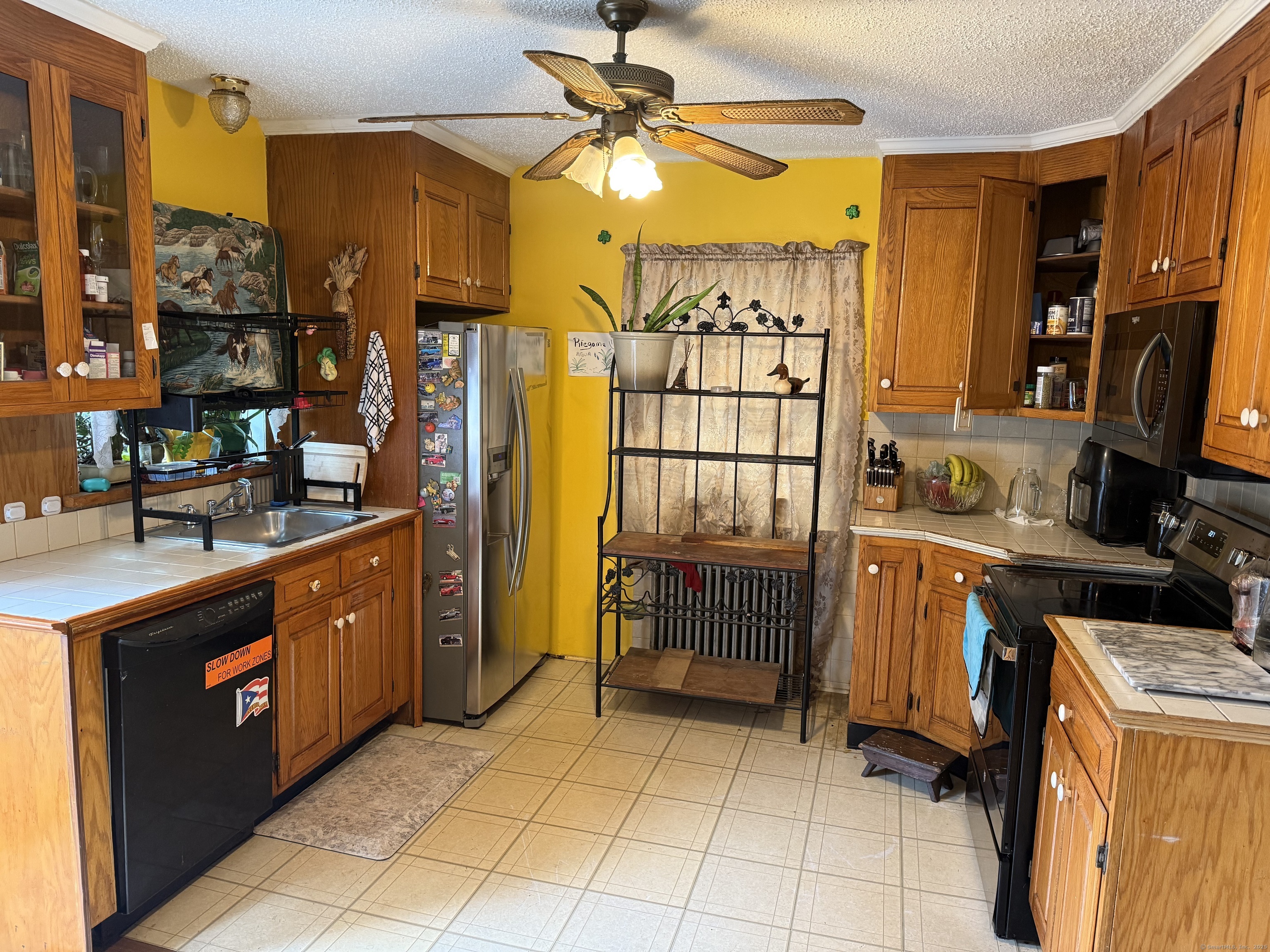 181 City View Avenue Bridgeport, CT 06606 - Photo 10 of 33 a kitchen with a sink and a refrigerator