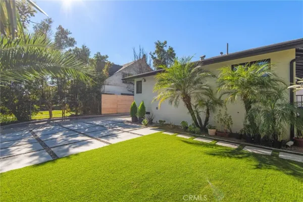 a view of a yard with a patio