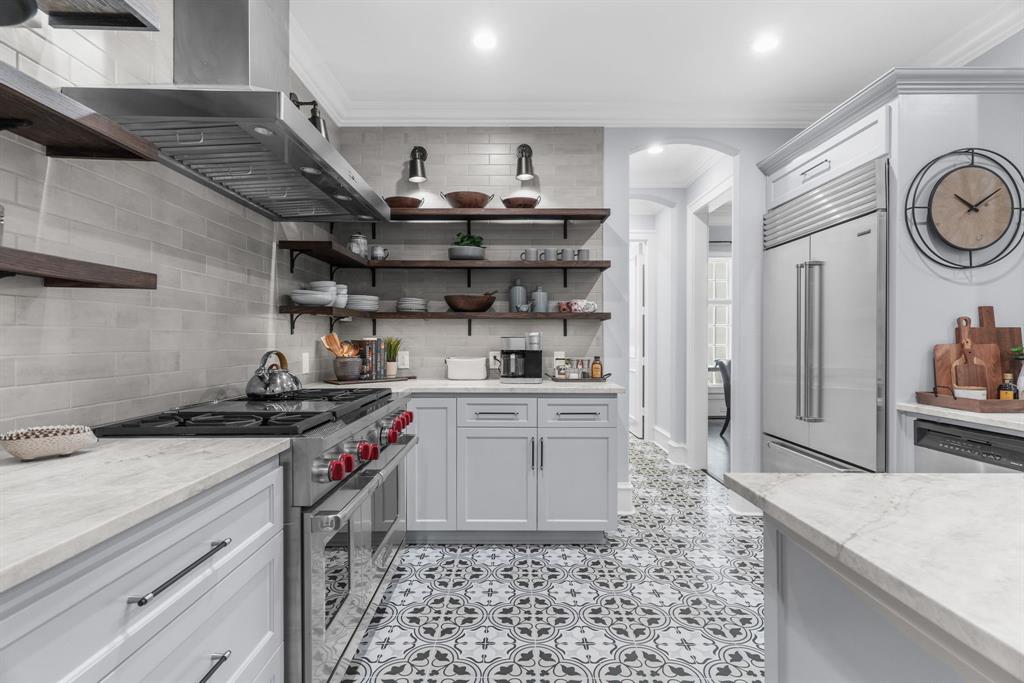 2222 Worthington Street Dallas, TX 75204 - Photo 12 of 39 a kitchen with a stove and a refrigerator