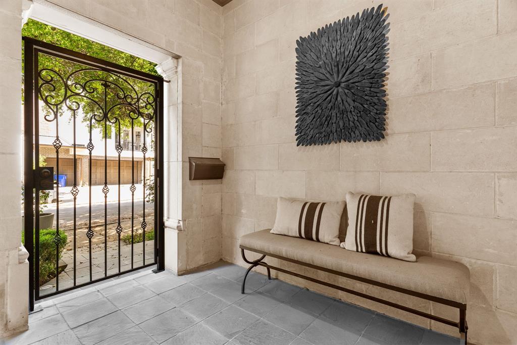 2222 Worthington Street Dallas, TX 75204 - Photo 2 of 39 a living room with furniture and a floor to ceiling window