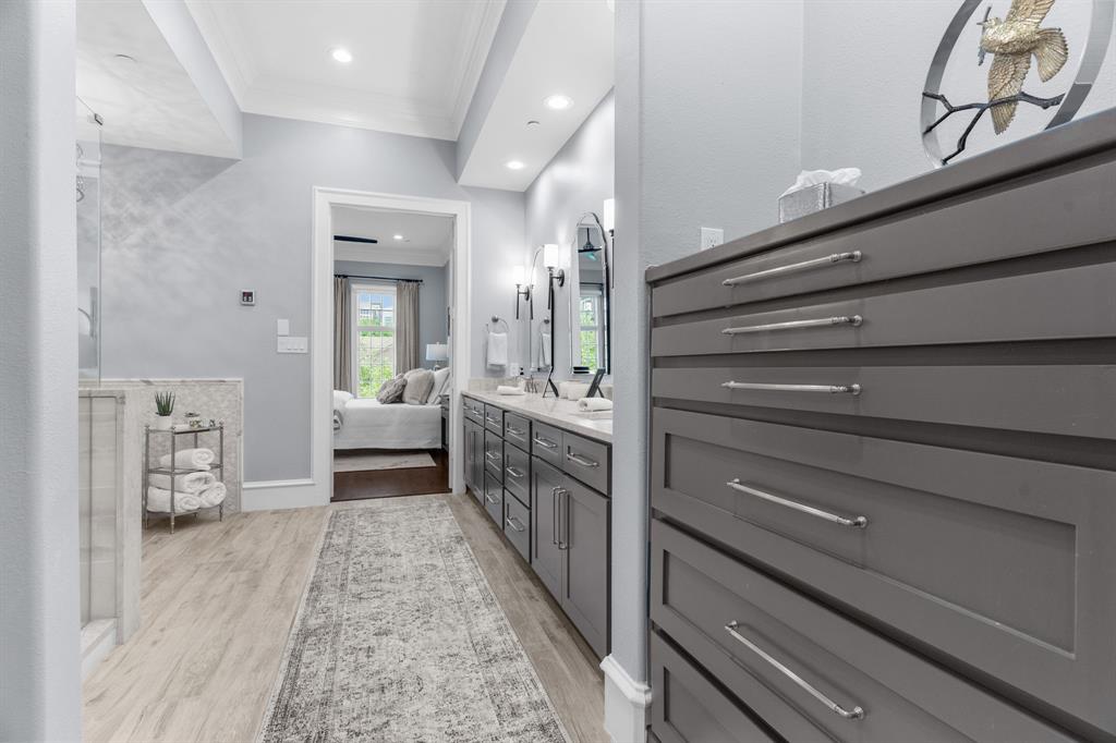 2222 Worthington Street Dallas, TX 75204 - Photo 30 of 39 a bathroom with a sink a mirror and a toilet