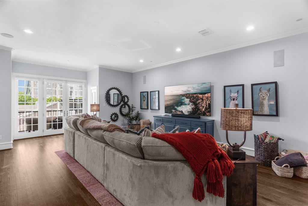 2222 Worthington Street Dallas, TX 75204 - Photo 33 of 39 a living room with furniture and a flat screen tv