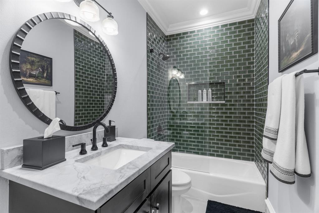 2222 Worthington Street Dallas, TX 75204 - Photo 7 of 39 a bathroom with a sink a toilet and shower