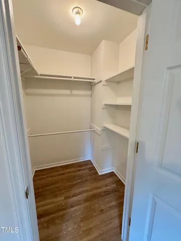 a view of an empty walk in closet
