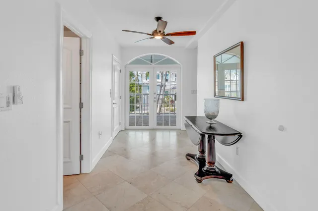 a kitchen with granite countertop a stove and white cabinets