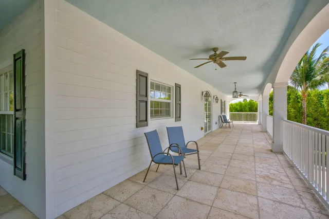 a view of a livingroom with a hardwood floor and a ceiling fan
