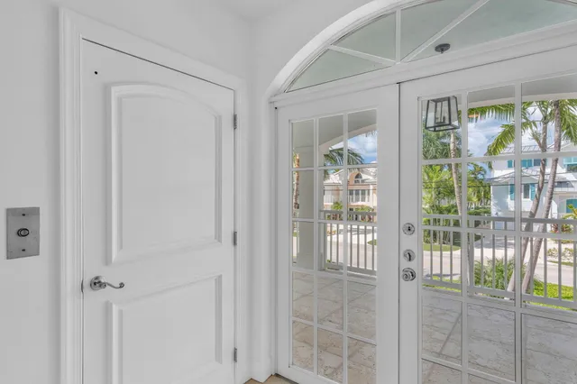 a view of a porch with furniture and a yard