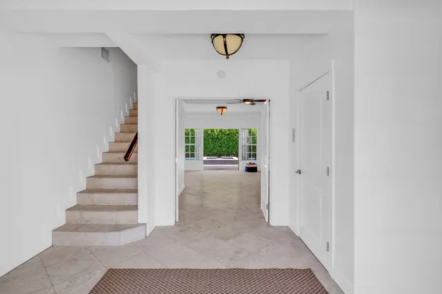 a bedroom with furniture and window