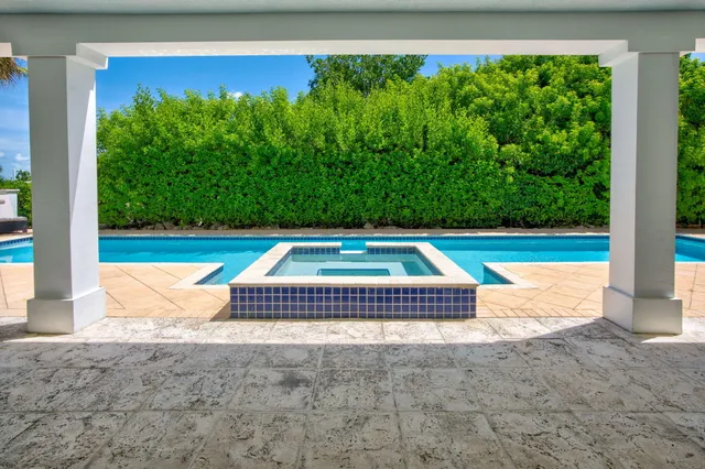 a view of swimming pool with outdoor seating