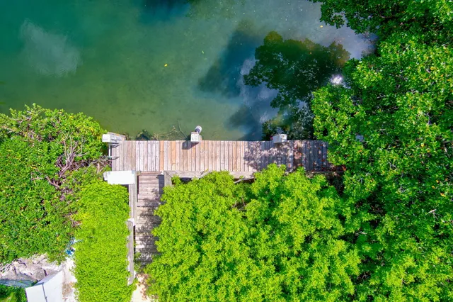 a terrace with outdoor seating and city view