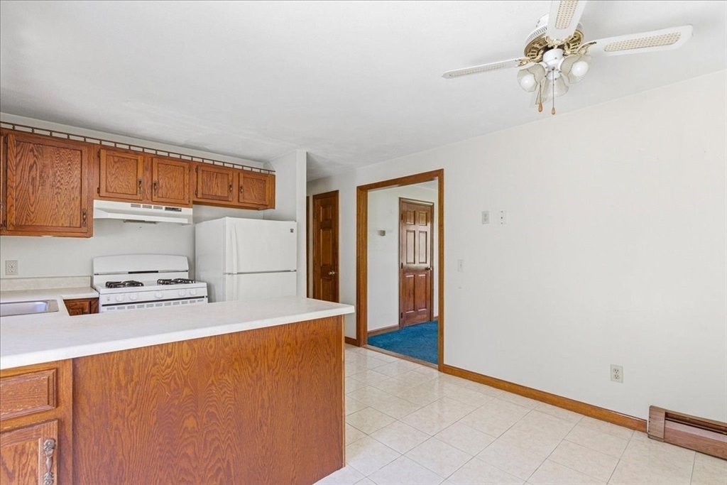 46 Willow Ridge Drive, Unit 46 Bridgewater, MA 02324 - Photo 14 of 40 a kitchen with stainless steel appliances a refrigerator a sink dishwasher with a stove and cabinets