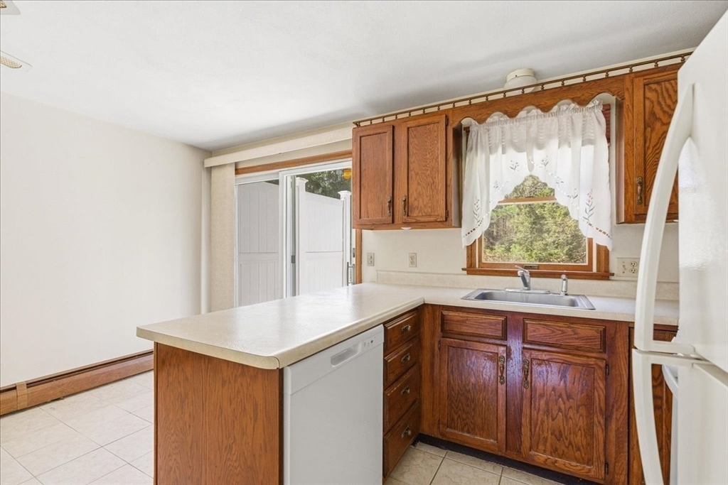 46 Willow Ridge Drive, Unit 46 Bridgewater, MA 02324 - Photo 18 of 40 a kitchen with a sink and a window