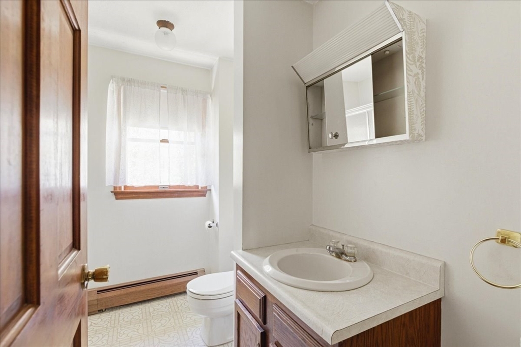 46 Willow Ridge Drive, Unit 46 Bridgewater, MA 02324 - Photo 20 of 40 a bathroom with a sink a toilet and a mirror