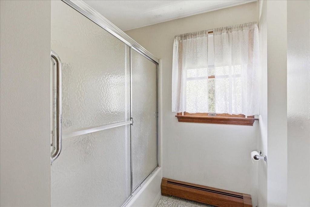 46 Willow Ridge Drive, Unit 46 Bridgewater, MA 02324 - Photo 21 of 40 a bathroom with a window and a shower
