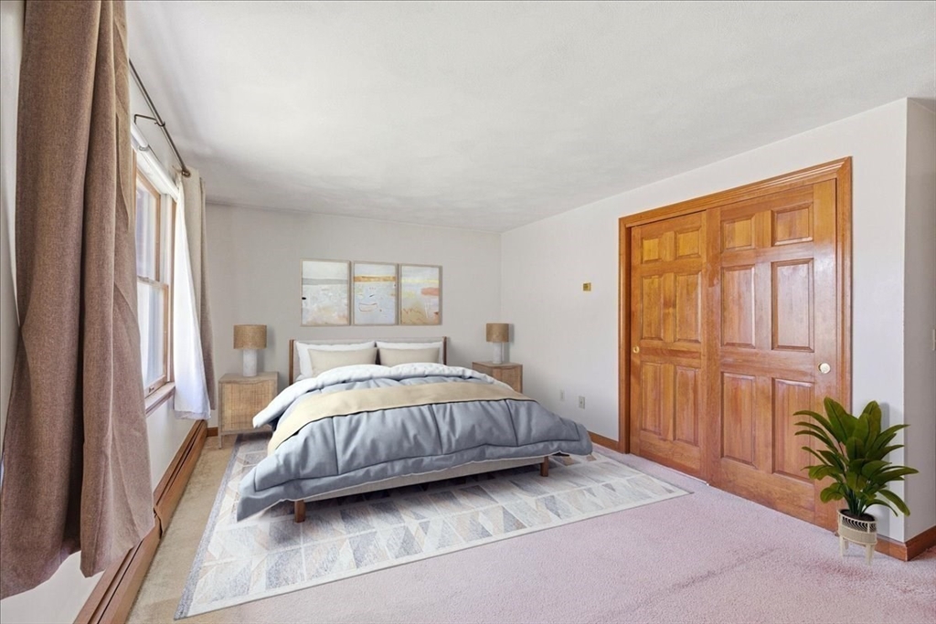 46 Willow Ridge Drive, Unit 46 Bridgewater, MA 02324 - Photo 22 of 40 a bedroom with a bed lamp and a window