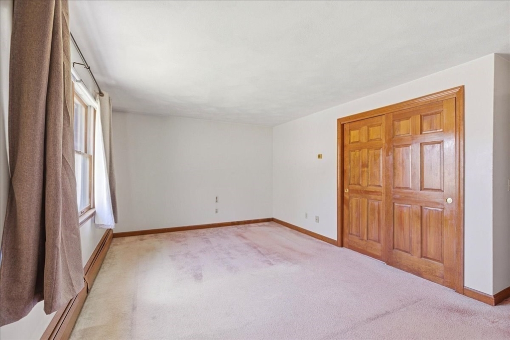 46 Willow Ridge Drive, Unit 46 Bridgewater, MA 02324 - Photo 23 of 40 an empty room with windows