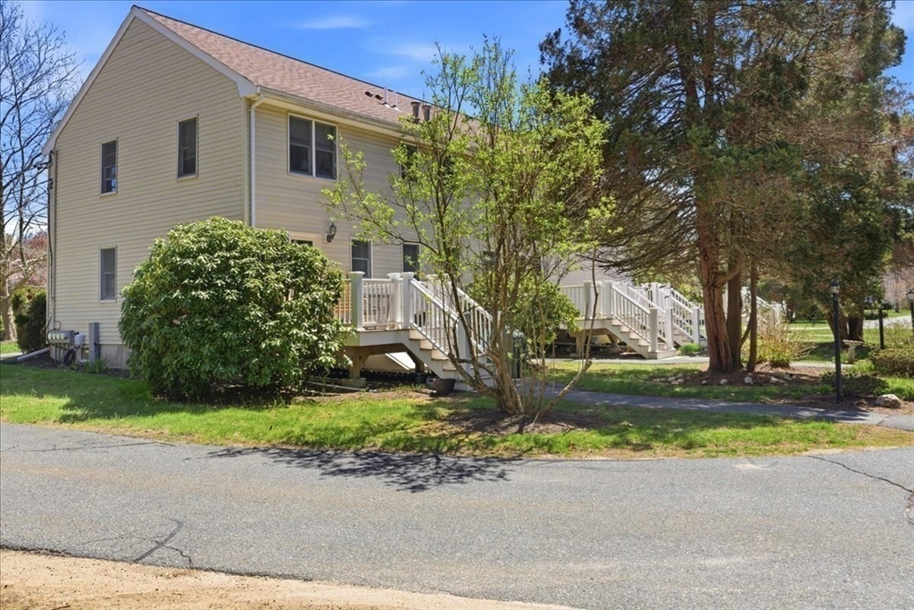 46 Willow Ridge Drive, Unit 46 Bridgewater, MA 02324 - Photo 38 of 40 a house that has a tree in front of it