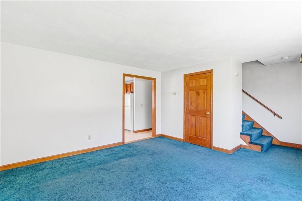 46 Willow Ridge Drive, Unit 46 Bridgewater, MA 02324 - Photo 6 of 40 a view of an empty room with stairs