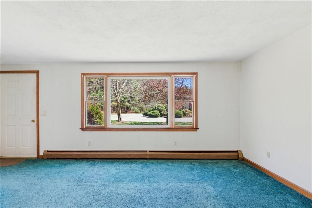 46 Willow Ridge Drive, Unit 46 Bridgewater, MA 02324 - Photo 8 of 40 an empty room with a window