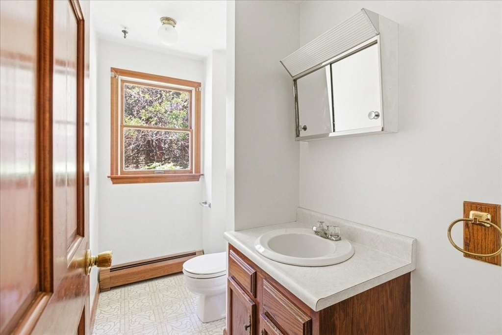 46 Willow Ridge Drive, Unit 46 Bridgewater, MA 02324 - Photo 9 of 40 a bathroom with a sink toilet and a mirror
