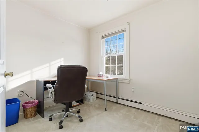 a bathroom with a shower and a sink