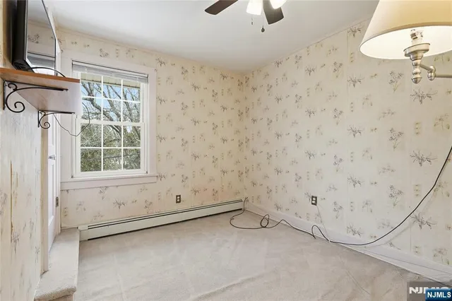 a bathroom with a glass shower door