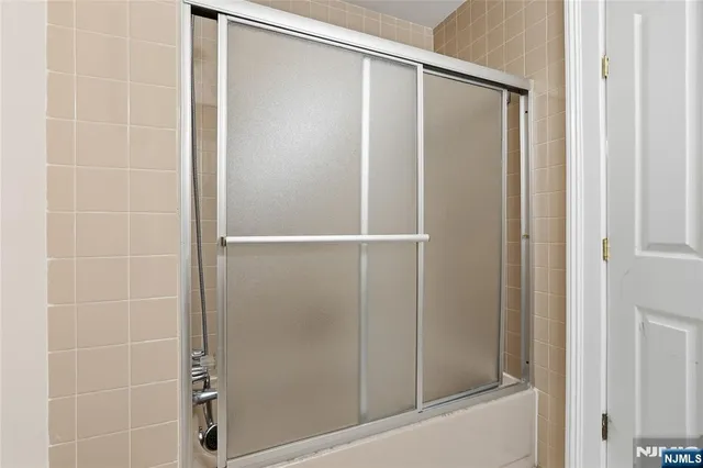 a room with wooden floor and furniture