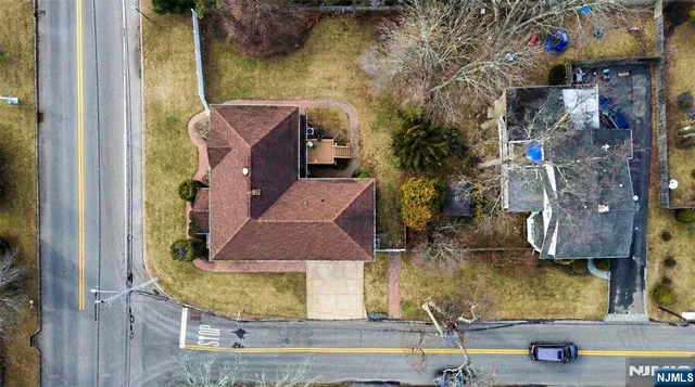 a view of a house with a backyard