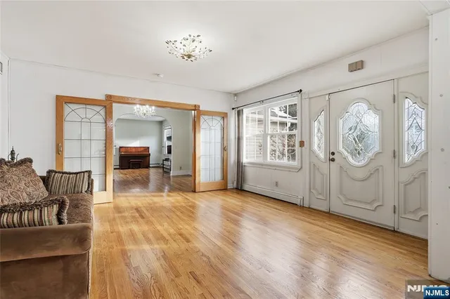 a view of livingroom with furniture and workspace