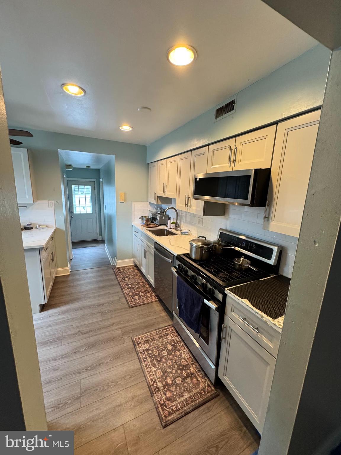 461 Old Erial Road Sicklerville, NJ 08081 - Photo 26 of 34 a kitchen with stainless steel appliances granite countertop a stove a sink and a microwave