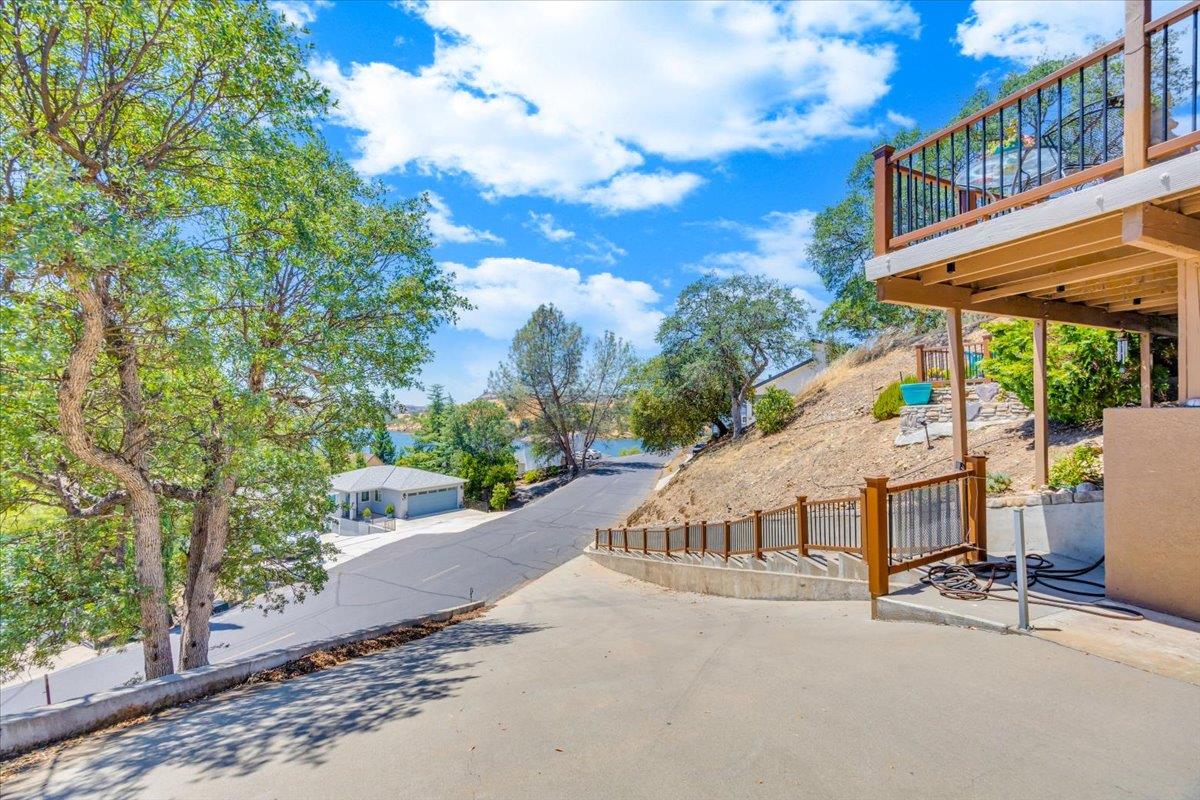 411 Sunrise Road Copperopolis, CA 95228 - Photo 52 of 76 View from the garage down the driveway. Extra covered storage area under the large deck.